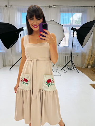 Beige dress with red peony embroidery on the pockets