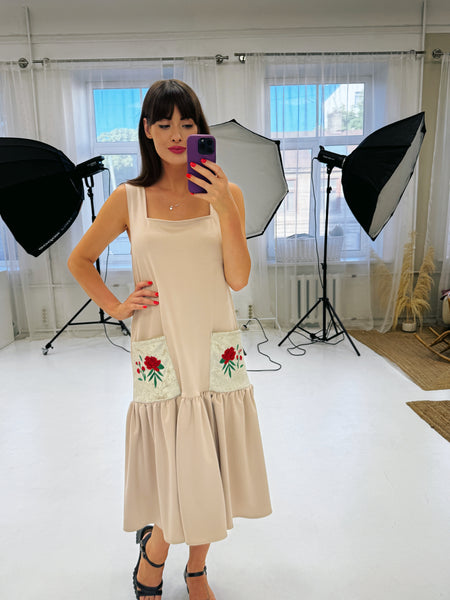 Beige dress with red peony embroidery on the pockets